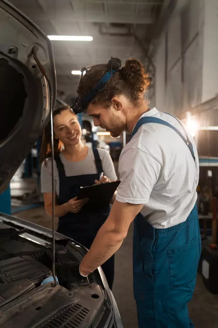 male-female-mechanics-working-shop